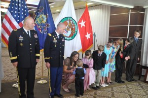 Down the line, the kids hand Dad his beret.